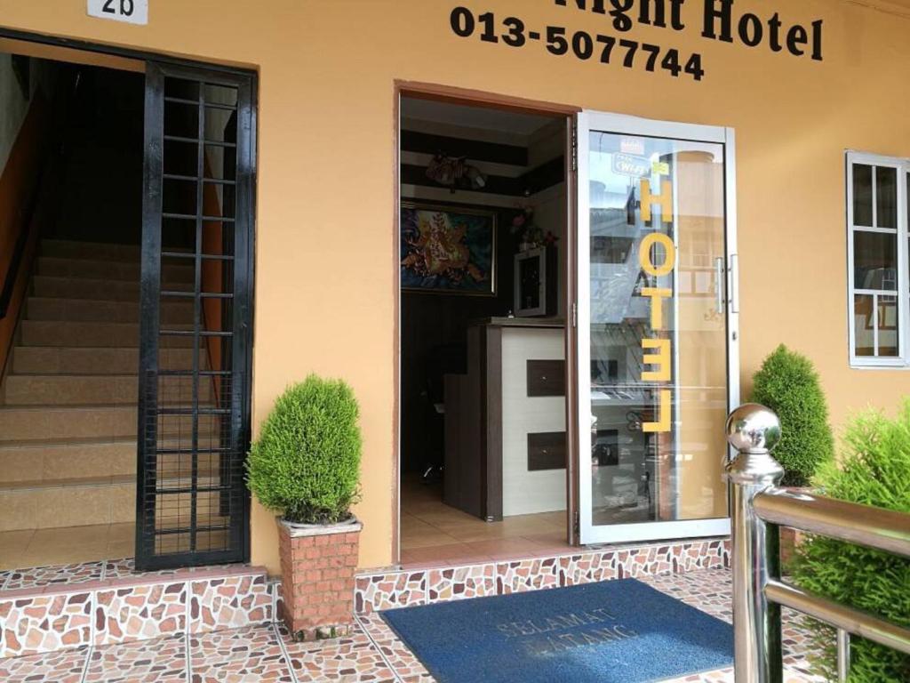 a front door of a hotel with a refrigerator at Golden Night Hotel Cameron Highlands in Cameron Highlands