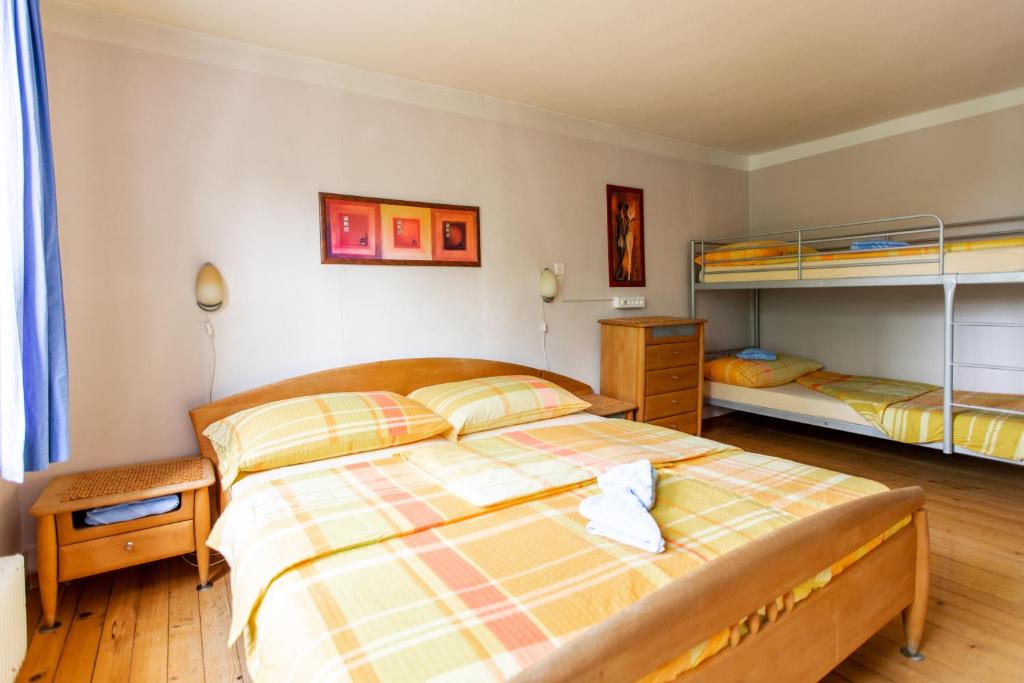 Postel nebo postele na pokoji v ubytování Happy Inn Lodge