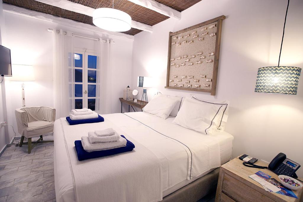 Postel nebo postele na pokoji v ubytování La Playa Boutique Apartments