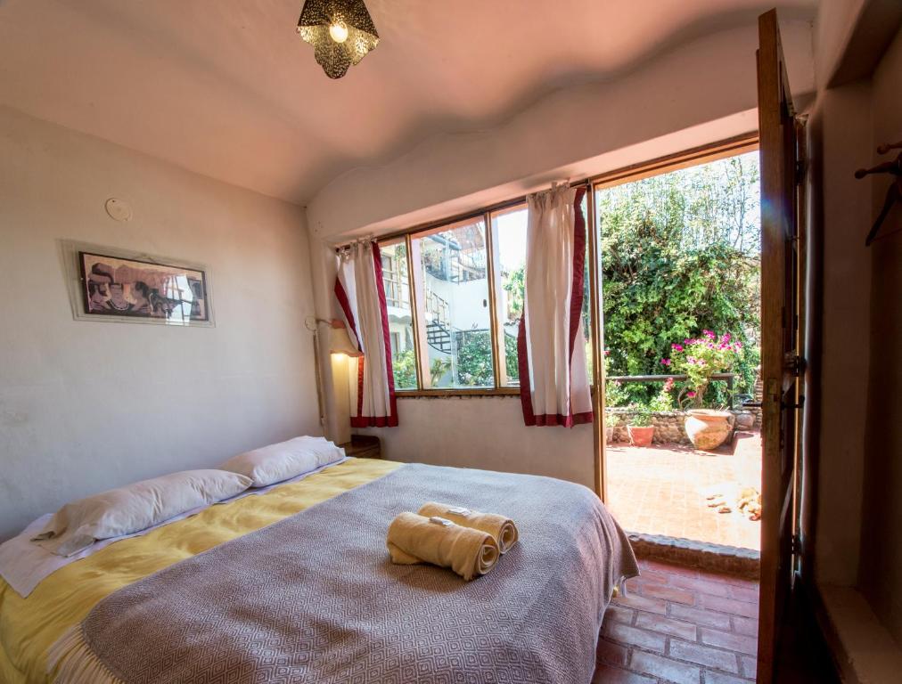 Postel nebo postele na pokoji v ubytování La Casa de Campo