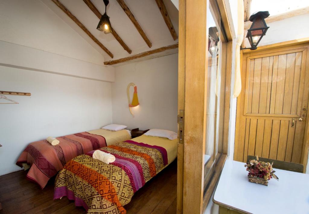 Postel nebo postele na pokoji v ubytování La Casa de Campo