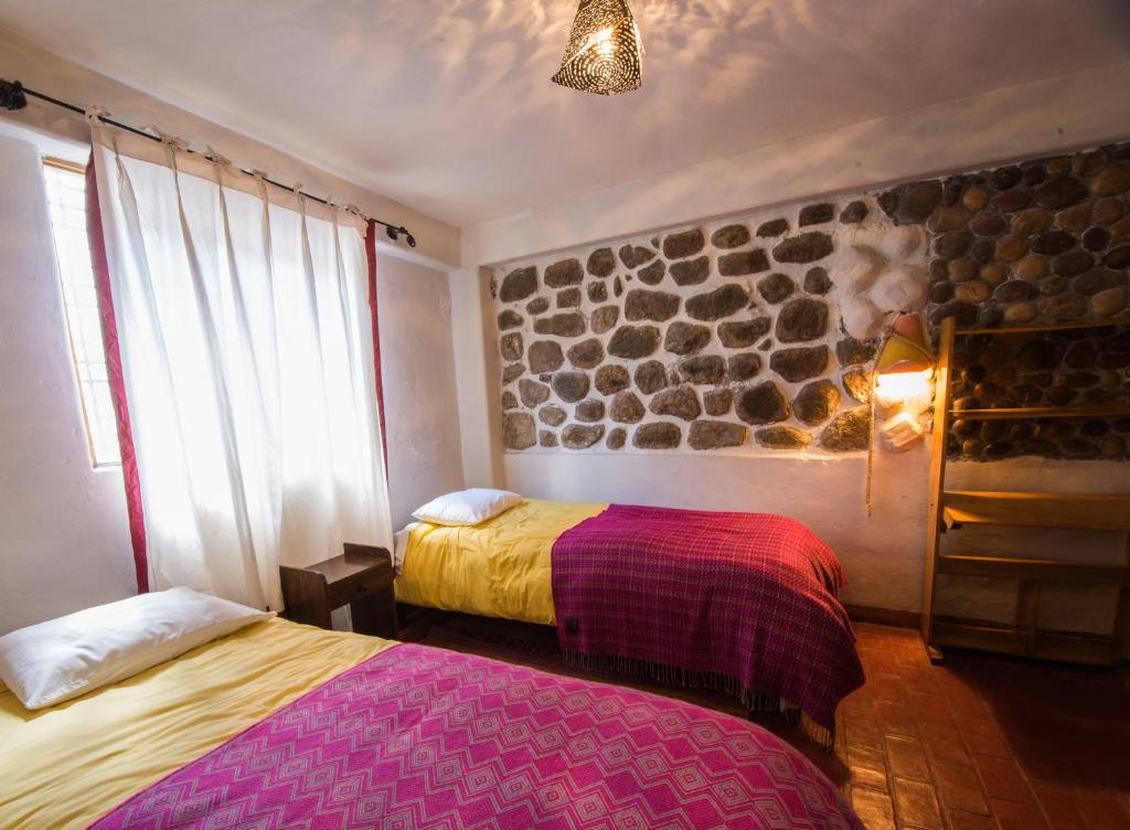 Postel nebo postele na pokoji v ubytování La Casa de Campo