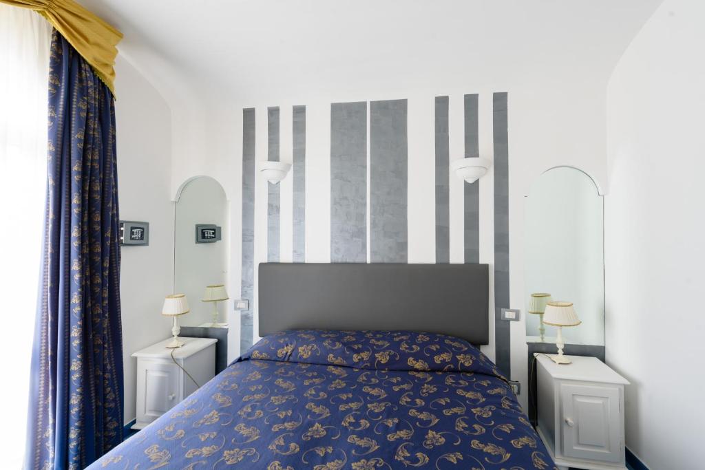 Postel nebo postele na pokoji v ubytování Hotel Bussola