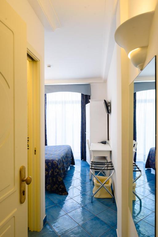 Postel nebo postele na pokoji v ubytování Hotel Bussola