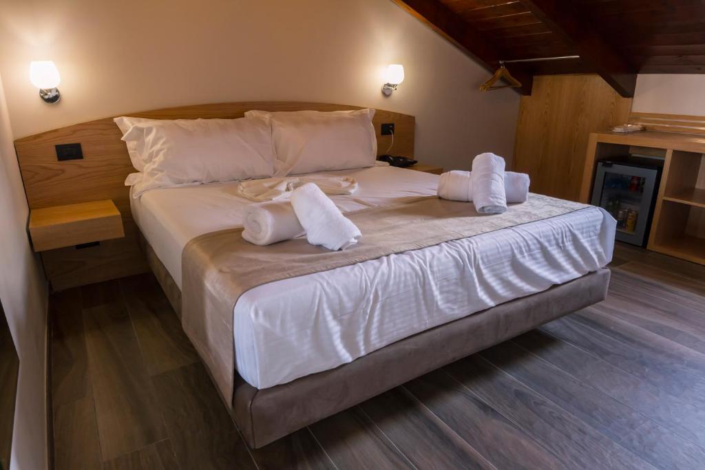 Postel nebo postele na pokoji v ubytování Hotel Pandora Residence