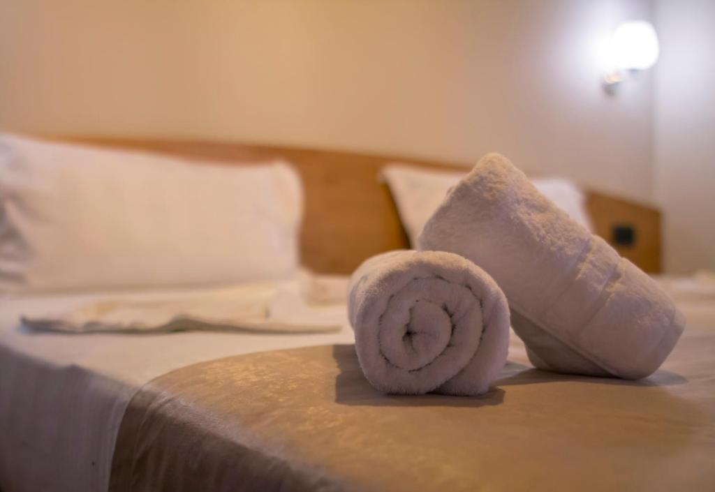 Postel nebo postele na pokoji v ubytování Hotel Pandora Residence