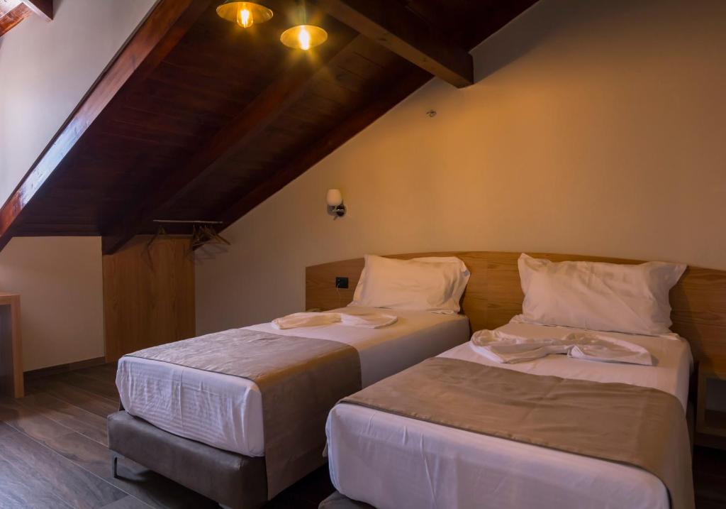 Postel nebo postele na pokoji v ubytování Hotel Pandora Residence