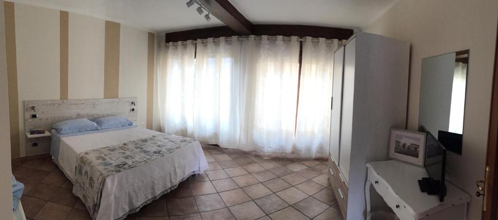 Postel nebo postele na pokoji v ubytování B&B sotto le mura