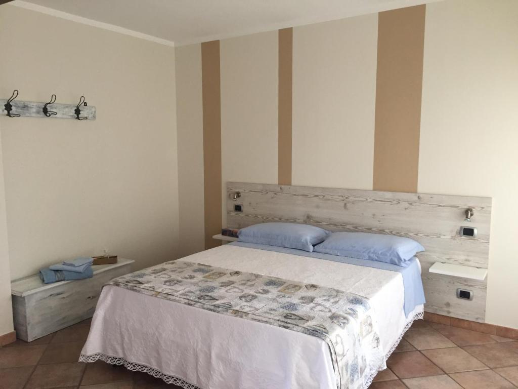 Postel nebo postele na pokoji v ubytování B&B sotto le mura