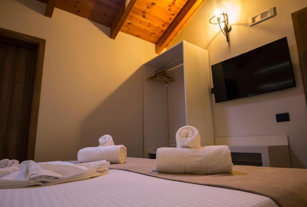 Postel nebo postele na pokoji v ubytování Hotel Pandora Residence