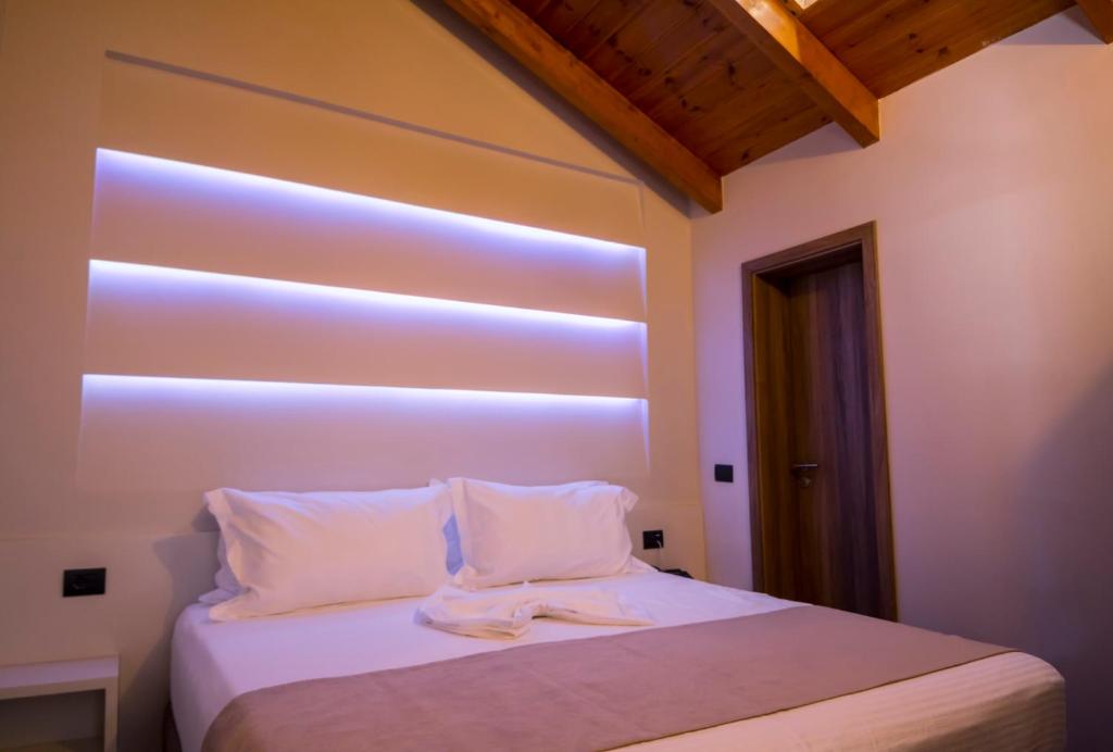 Postel nebo postele na pokoji v ubytování Hotel Pandora Residence