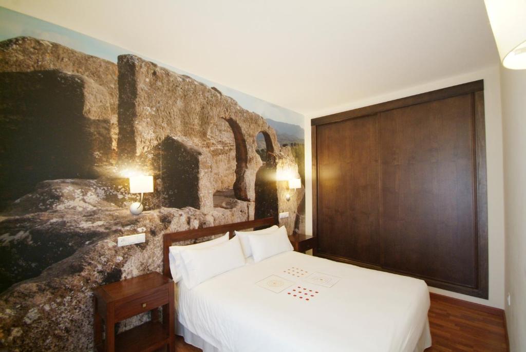 Ένα ή περισσότερα κρεβάτια σε δωμάτιο στο Apartamentos Ardales