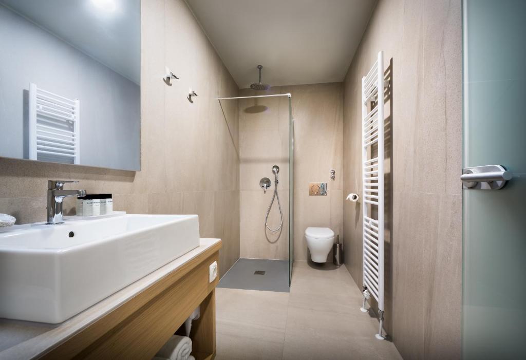 a bathroom with a sink and a shower at Hotel Vinotel Gospoja in Vrbnik