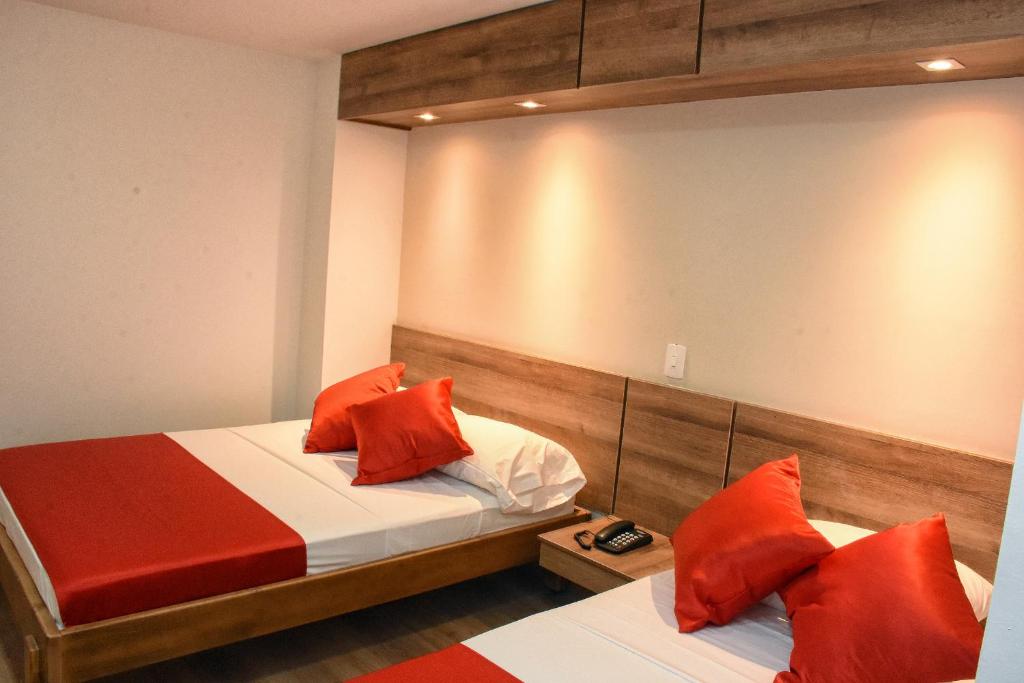 Postel nebo postele na pokoji v ubytování Hotel El Lago 1
