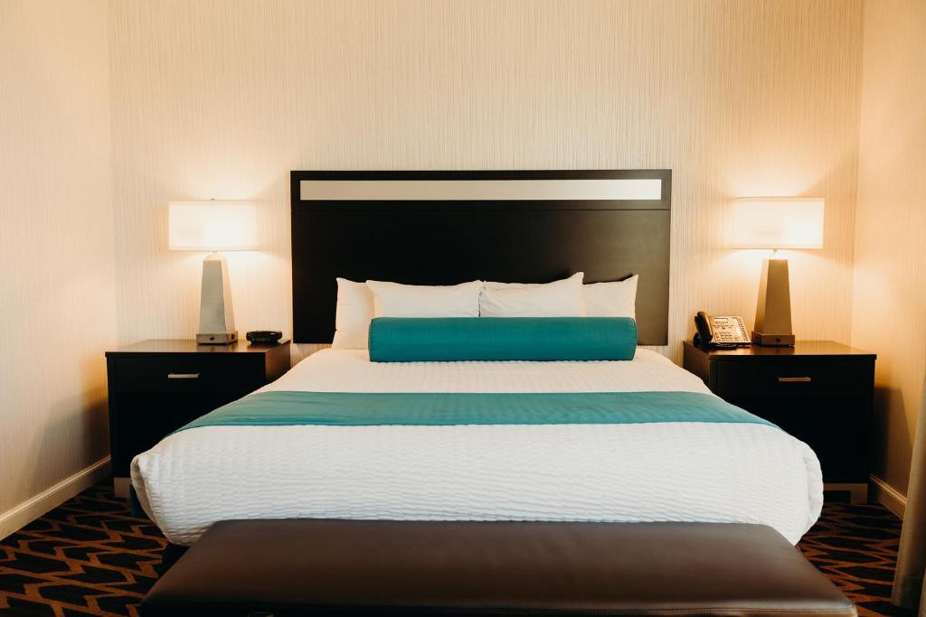 a large bed in a hotel room with two lamps at Gold Country Casino Resort in Oroville