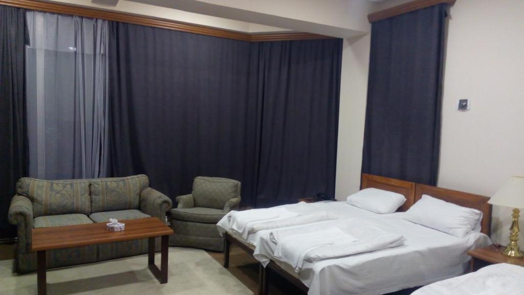 Postel nebo postele na pokoji v ubytování DownTown B&B