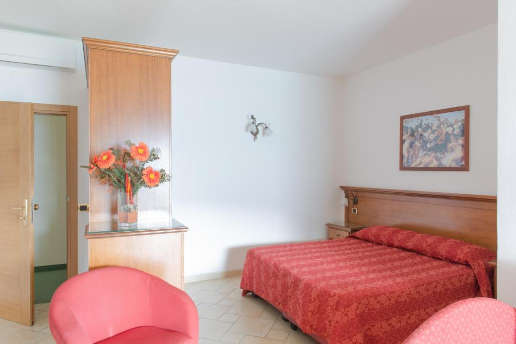 Postel nebo postele na pokoji v ubytování Village Hotel Lucia