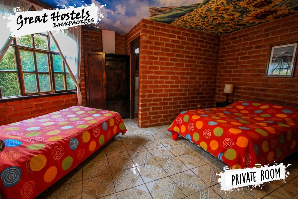 Postel nebo postele na pokoji v ubytování Great Hostels Backpackers
