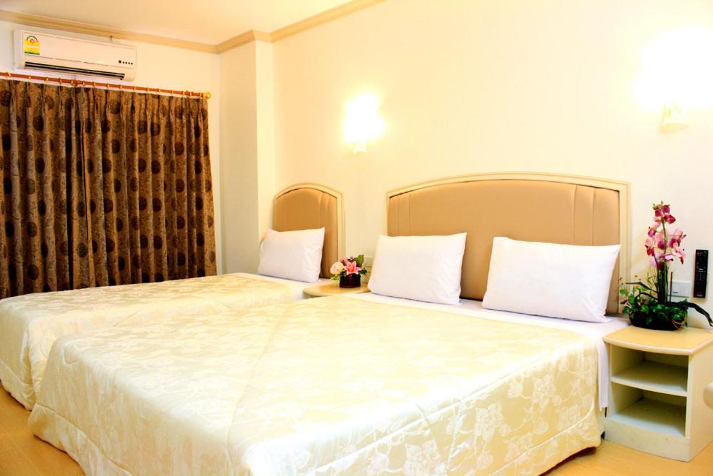 Postel nebo postele na pokoji v ubytování P.A. Ville Hotel