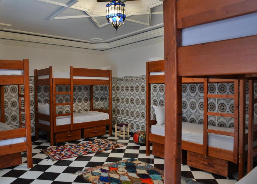 Postel nebo postele na pokoji v ubytování Mosaic Hostel