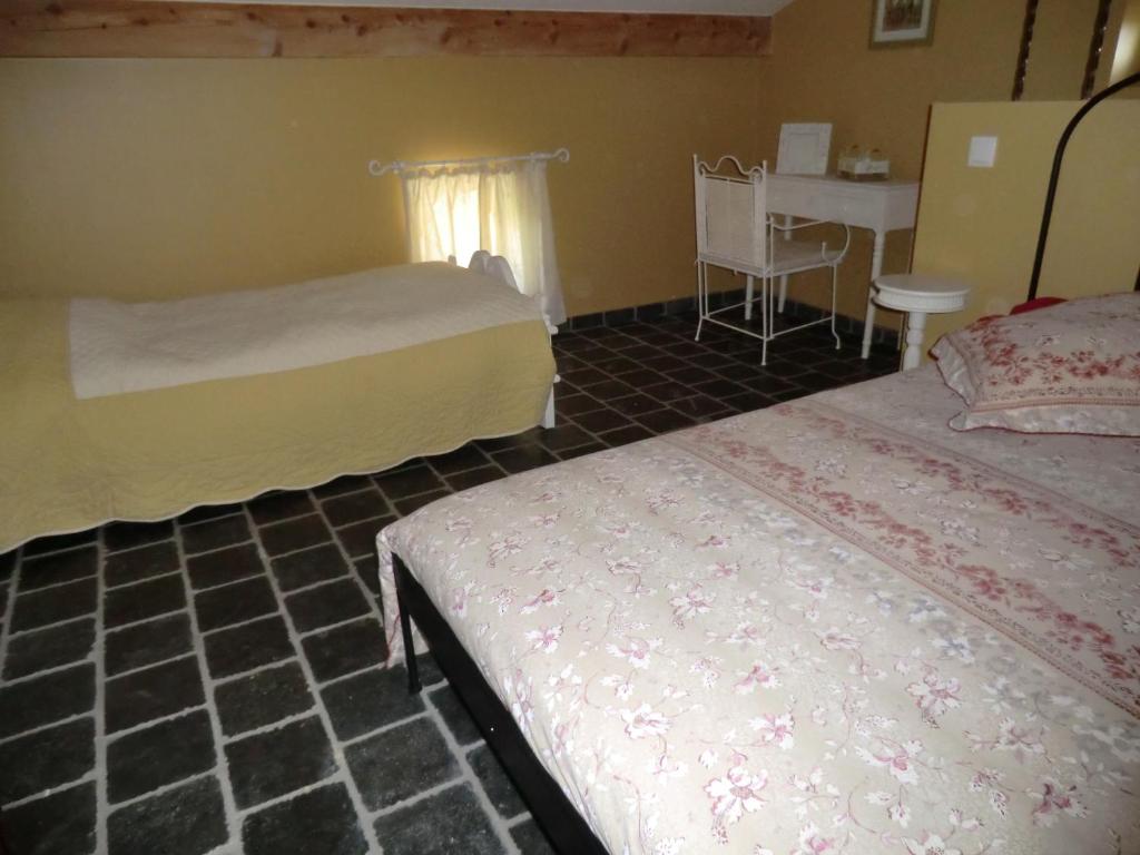Postel nebo postele na pokoji v ubytování La Bastide de Fontaille