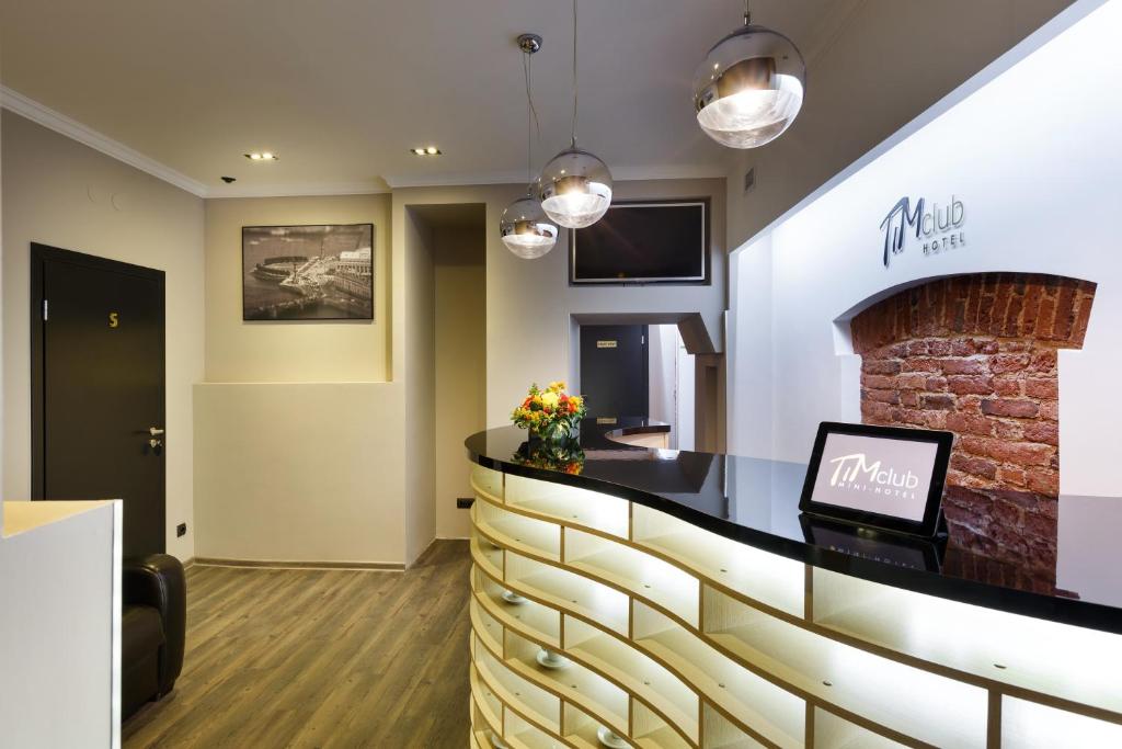 a bar in a dental office with a fireplace at Tim Club Hotel in Saint Petersburg