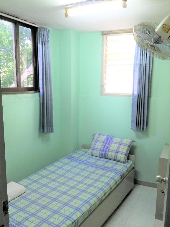 Postel nebo postele na pokoji v ubytování NAT 2 Guest House