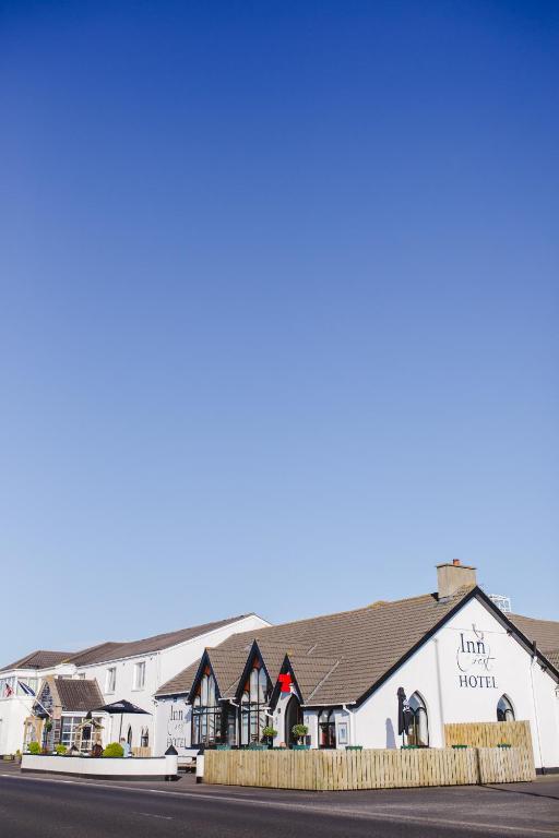 a view of the inn hotel on the corner of the street at Inn On The Coast in Portrush