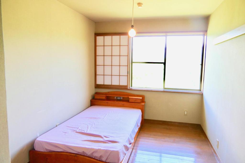 Letto o letti in una camera di FWA Guest House
