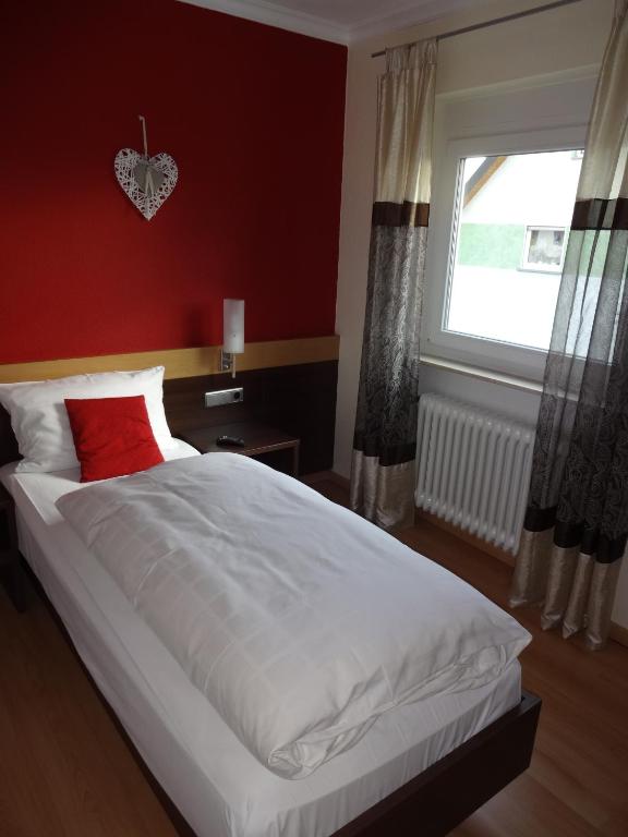 Postel nebo postele na pokoji v ubytování Hotel Ricci