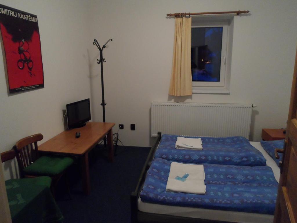 Postel nebo postele na pokoji v ubytování Penzion Novopacké Sklepy