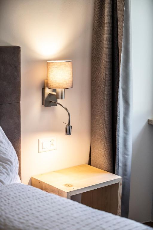 Postel nebo postele na pokoji v ubytování Hotel Münsterhof