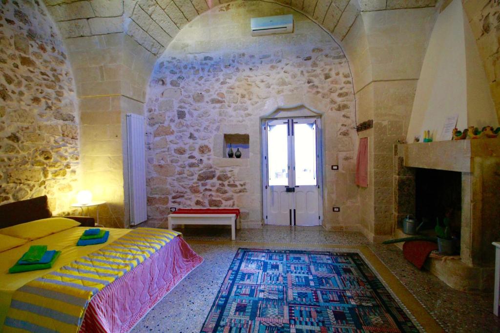 A bed or beds in a room at Dimora Storica San Giovanni