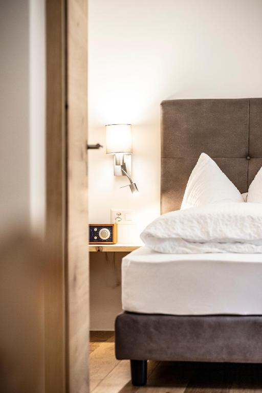 Postel nebo postele na pokoji v ubytování Hotel Münsterhof