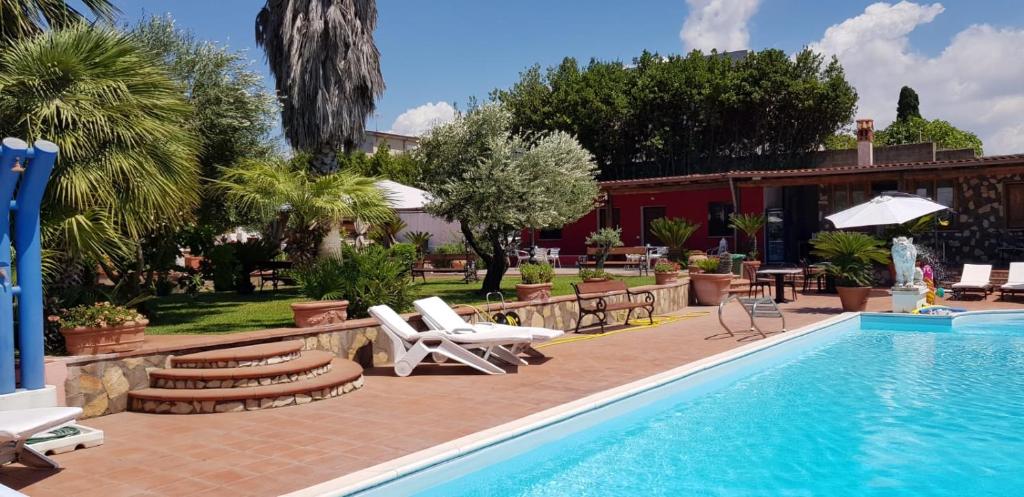 The swimming pool at or close to L'oasi di Ambra