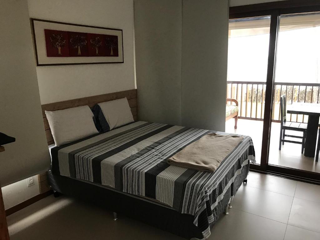 Postel nebo postele na pokoji v ubytování Bali Bahia Itacimirim