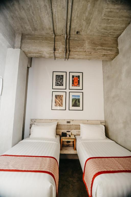 Postel nebo postele na pokoji v ubytování The Bricks Hotel