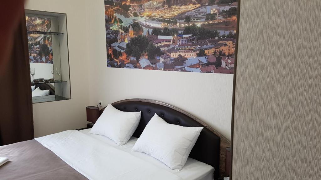 Postel nebo postele na pokoji v ubytování Sweet Rooms Inn