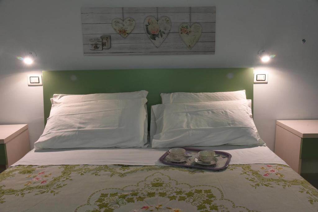 Postel nebo postele na pokoji v ubytování Albergo La Rosetta