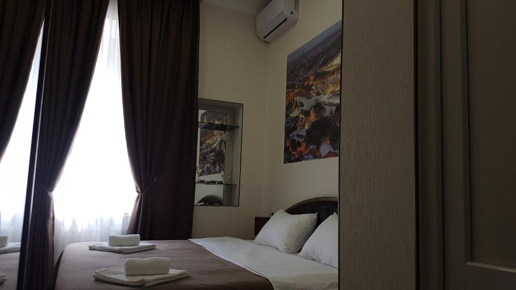 Postel nebo postele na pokoji v ubytování Sweet Rooms Inn