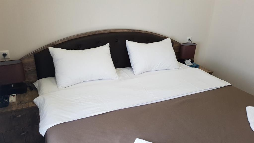 Postel nebo postele na pokoji v ubytování Sweet Rooms Inn