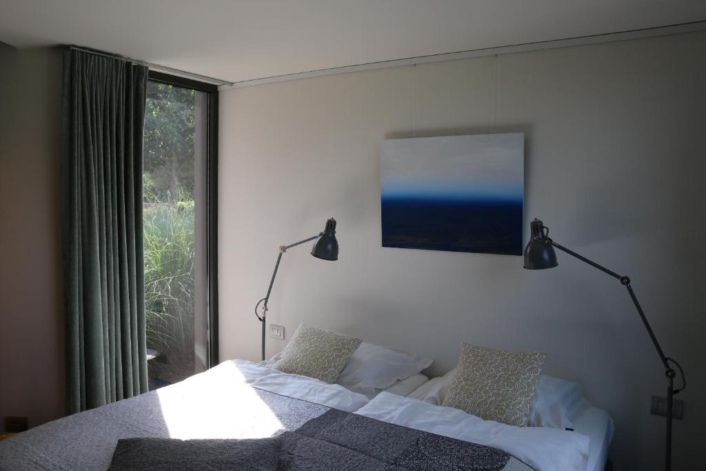 Postel nebo postele na pokoji v ubytování La Chambre d'Amis