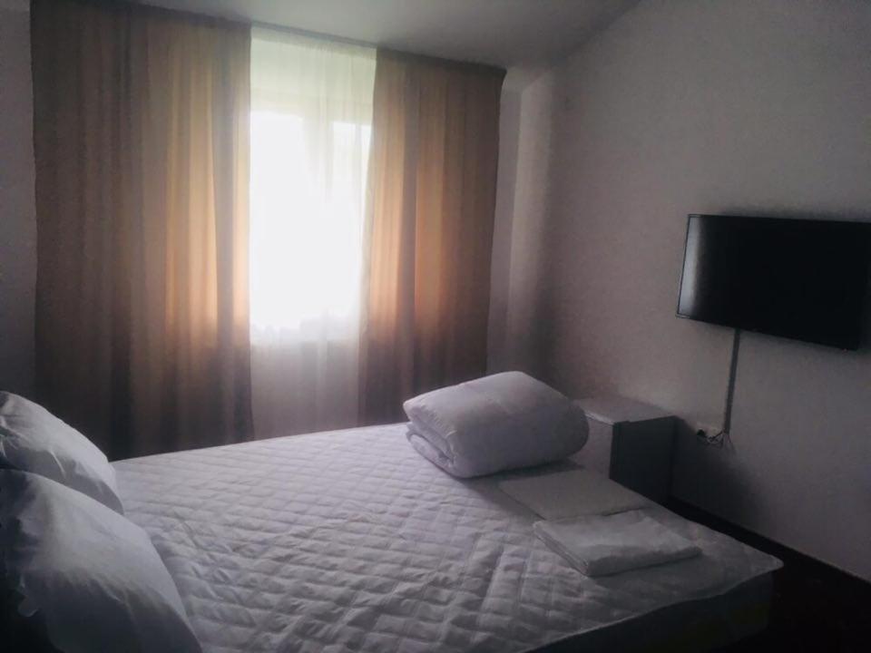 Postel nebo postele na pokoji v ubytování Hotel Ostrov