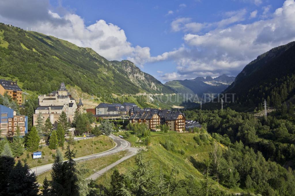 a town in the mountains with a road at Apartarent 1500 in Baqueira-Beret