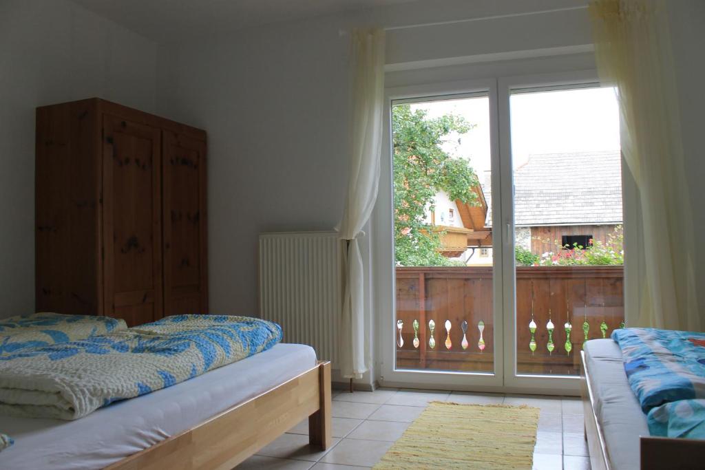 Postel nebo postele na pokoji v ubytování Ferienwohnung MINA - Rattendorf