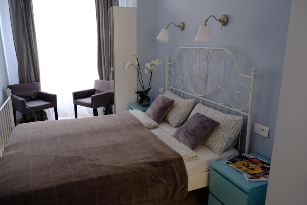 Postel nebo postele na pokoji v ubytování Apartments Monaco