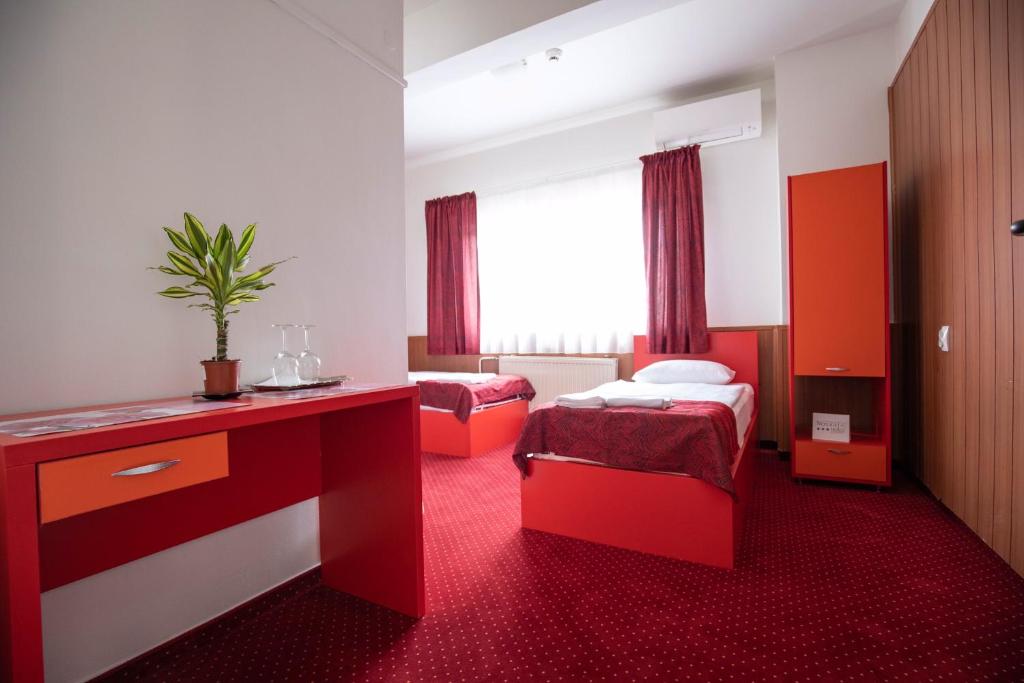 Posteľ alebo postele v izbe v ubytovaní Népliget Hotel