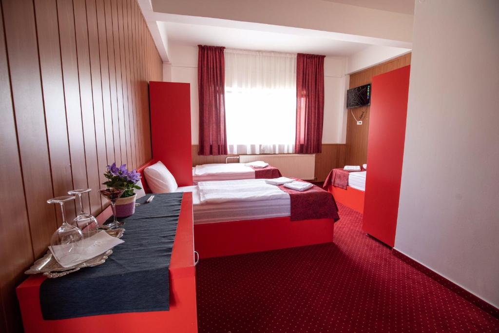 Posteľ alebo postele v izbe v ubytovaní Népliget Hotel
