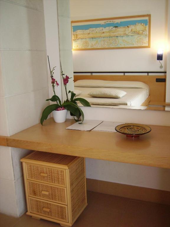Postel nebo postele na pokoji v ubytování Hotel Degli Haethey