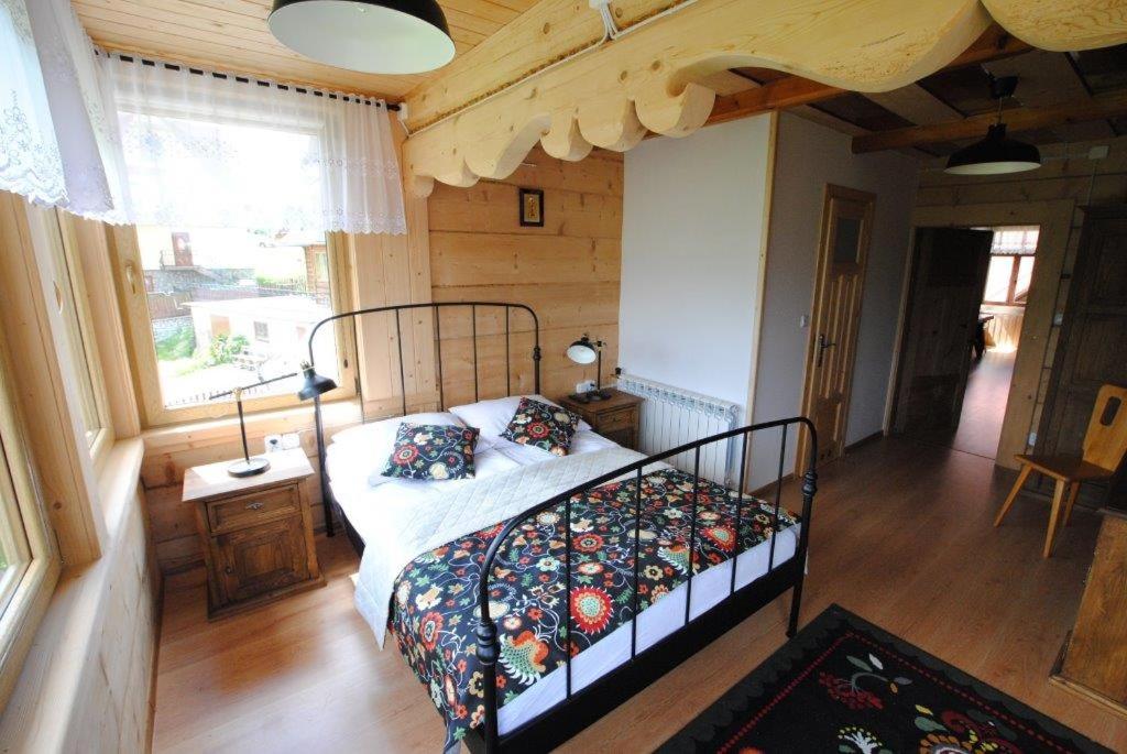 a bedroom with a bed in a room at Pokoje u Staszka in Bukowina Tatrzańska